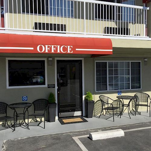 The image shows a building with a red awning labeled 